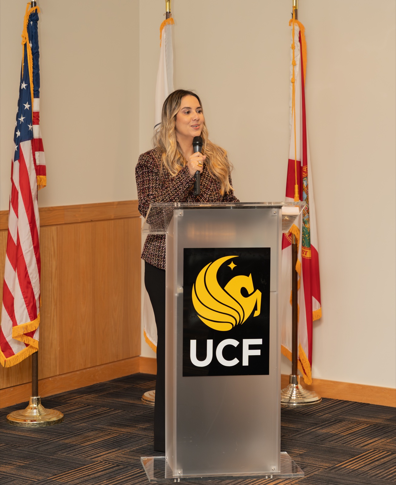 Cristiane Barreto speaking at the University of Central Florida UCF podium